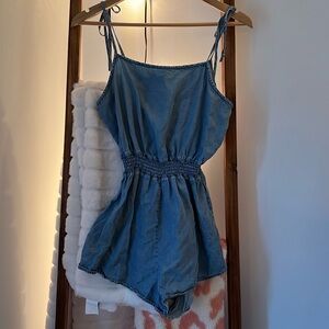 Jean-material romper with tie straps.